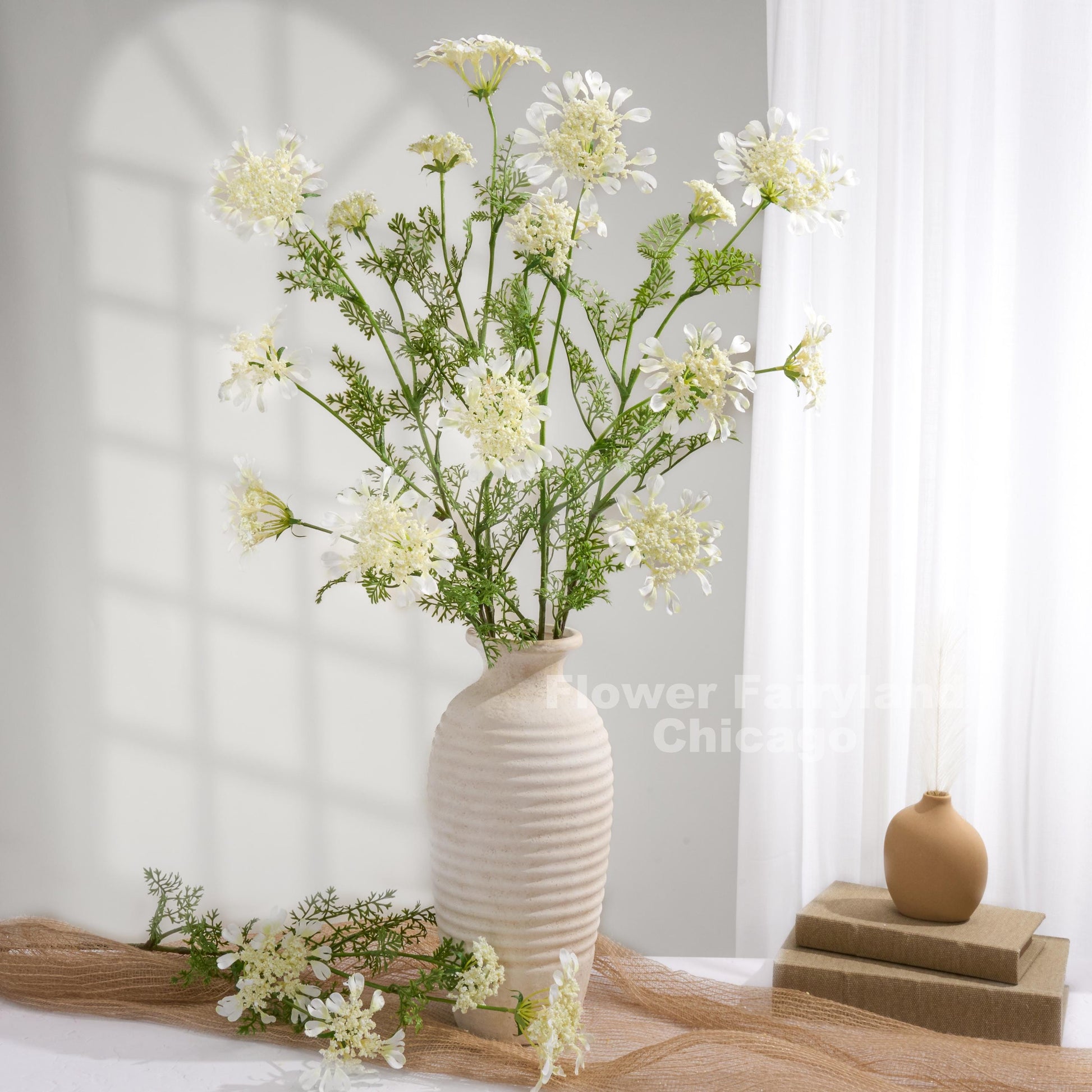White lace flowers styled in vase