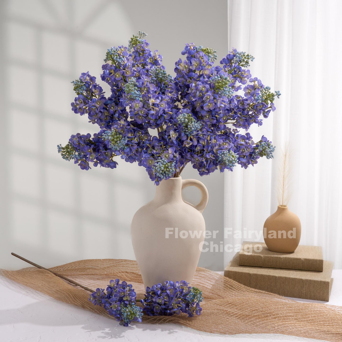 Blue lilac arrangement in vase