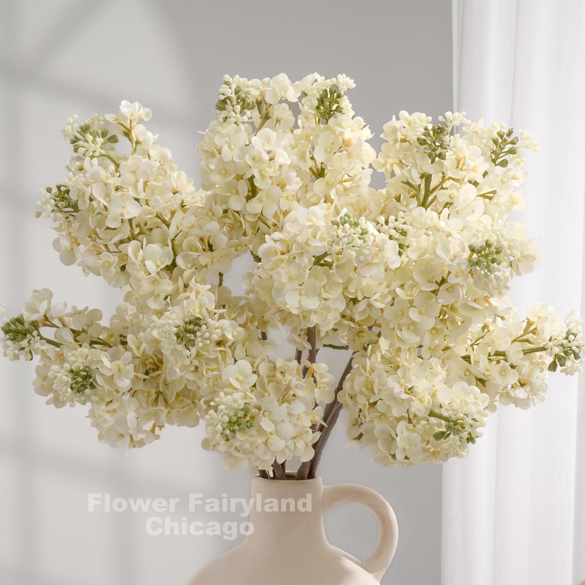 Ivory lilac arrangement in vase