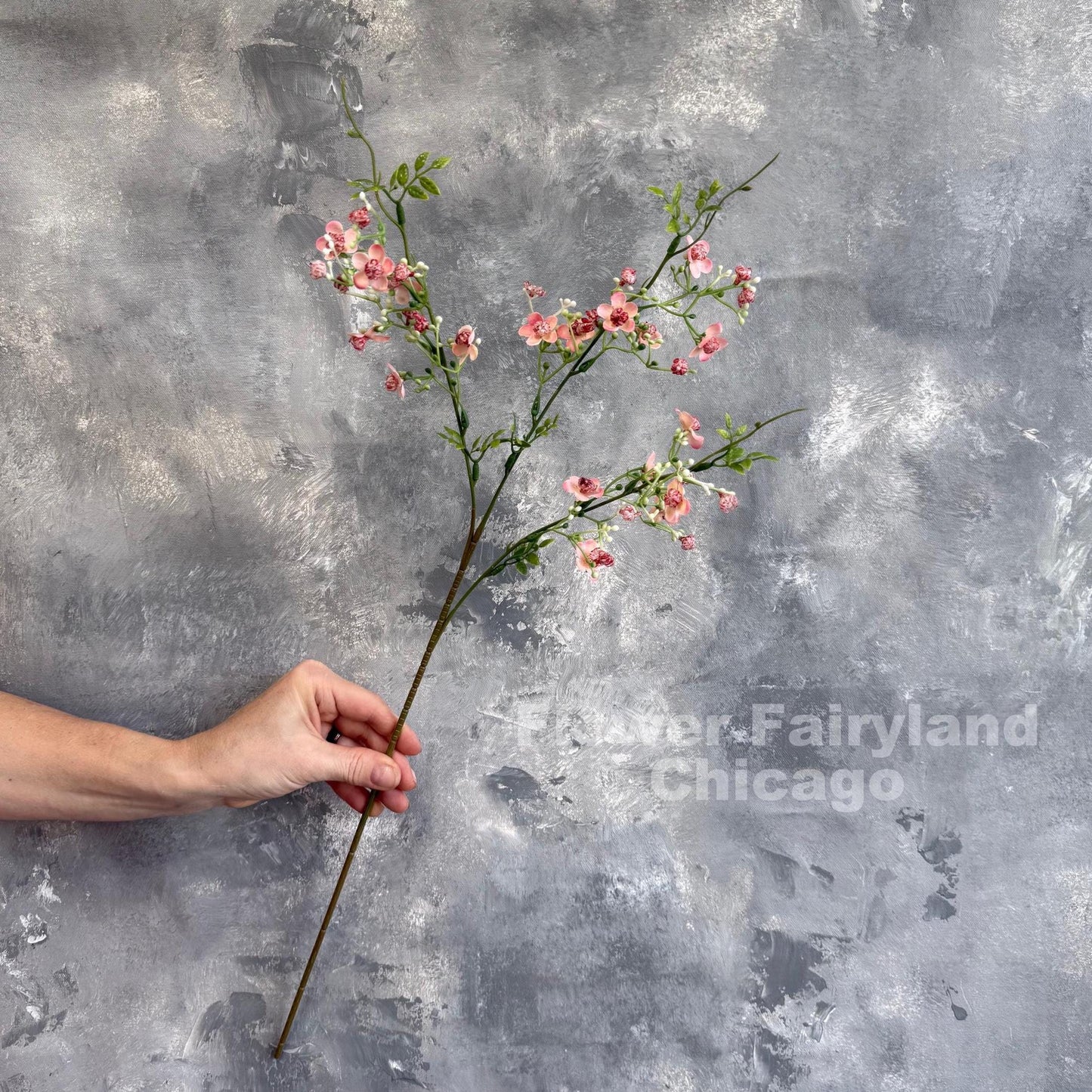 Pink faux wax flower branch detail