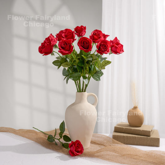Red roses styled in a cream vase