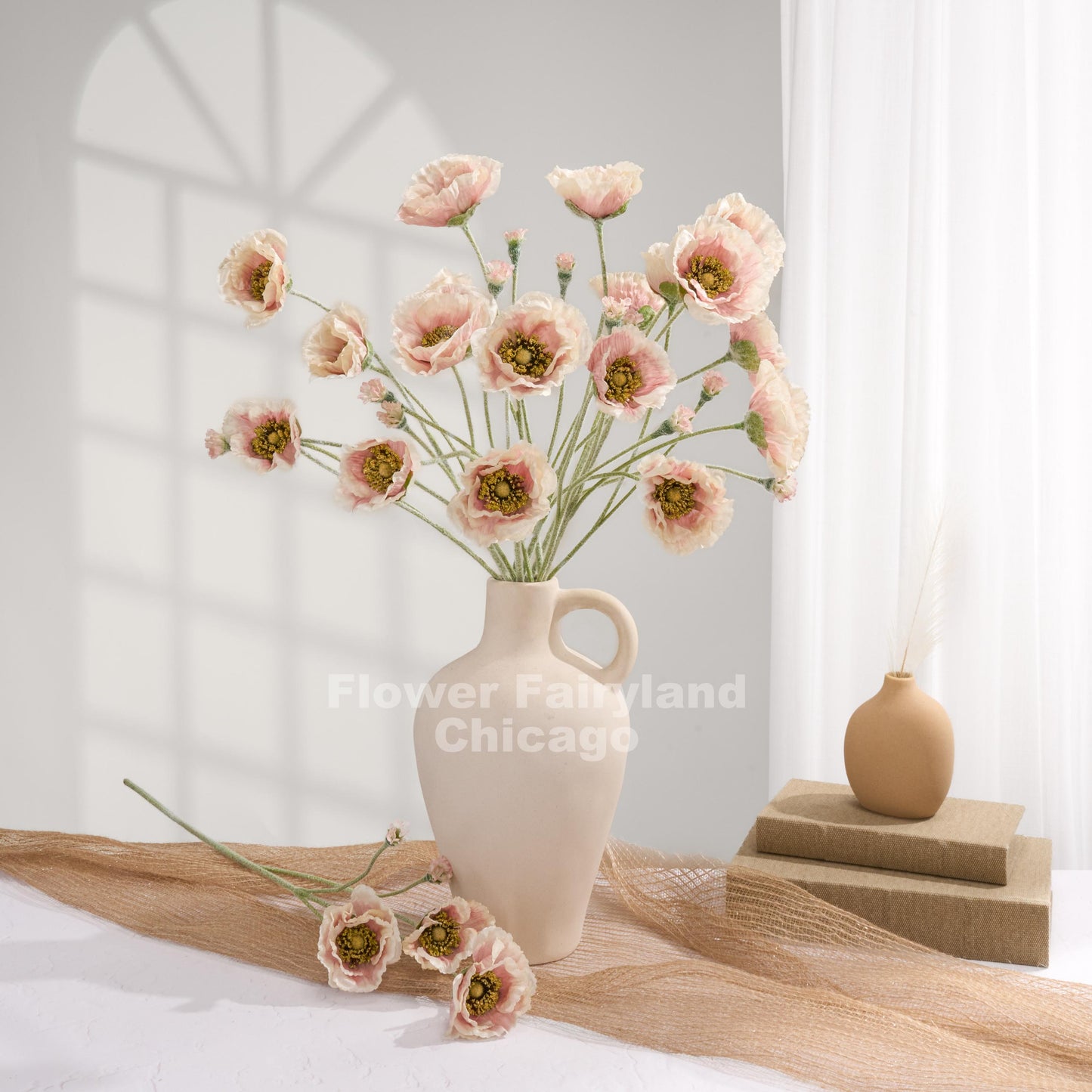 Pinky cream Iceland poppies styled in a vase