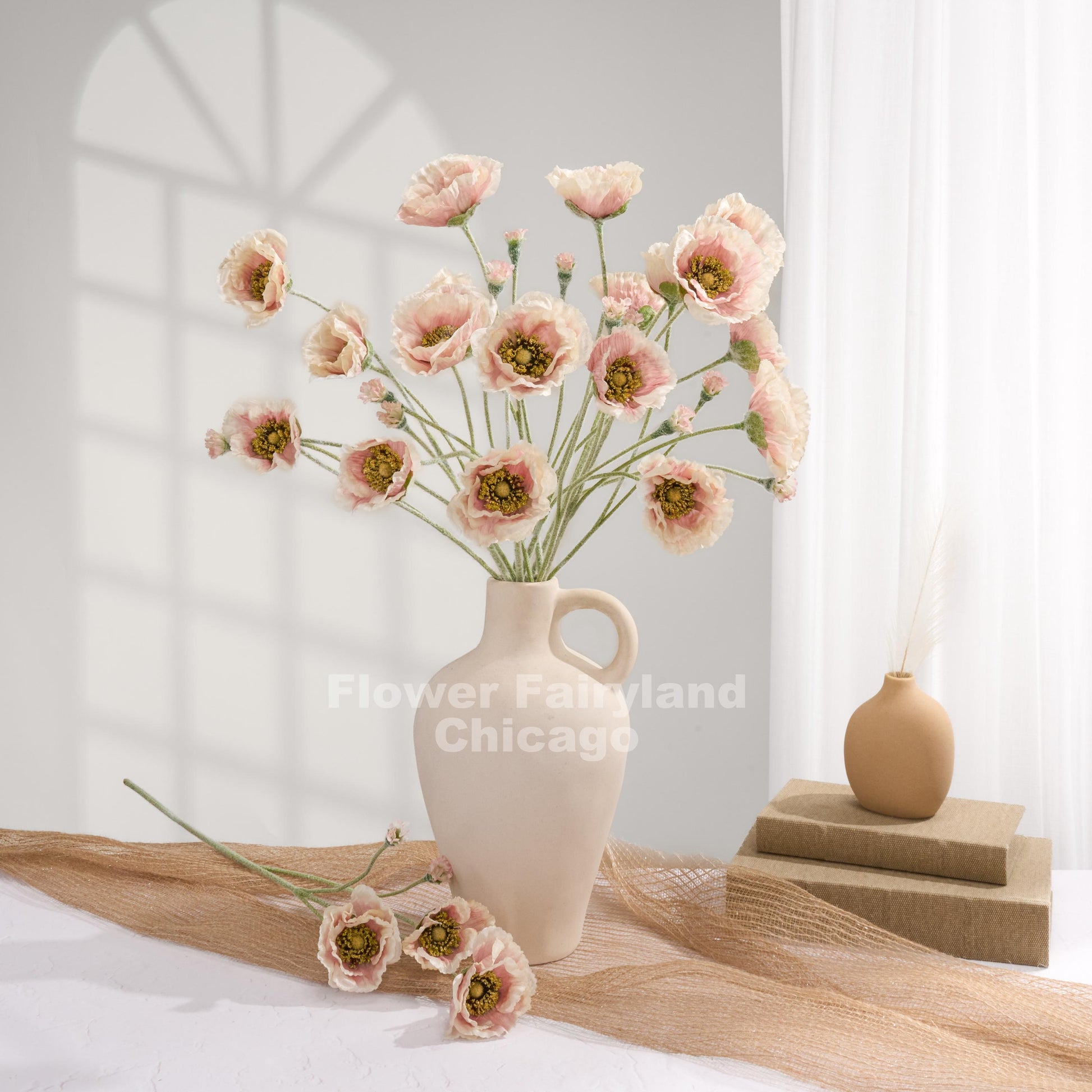 Pinky cream Iceland poppies styled in a vase