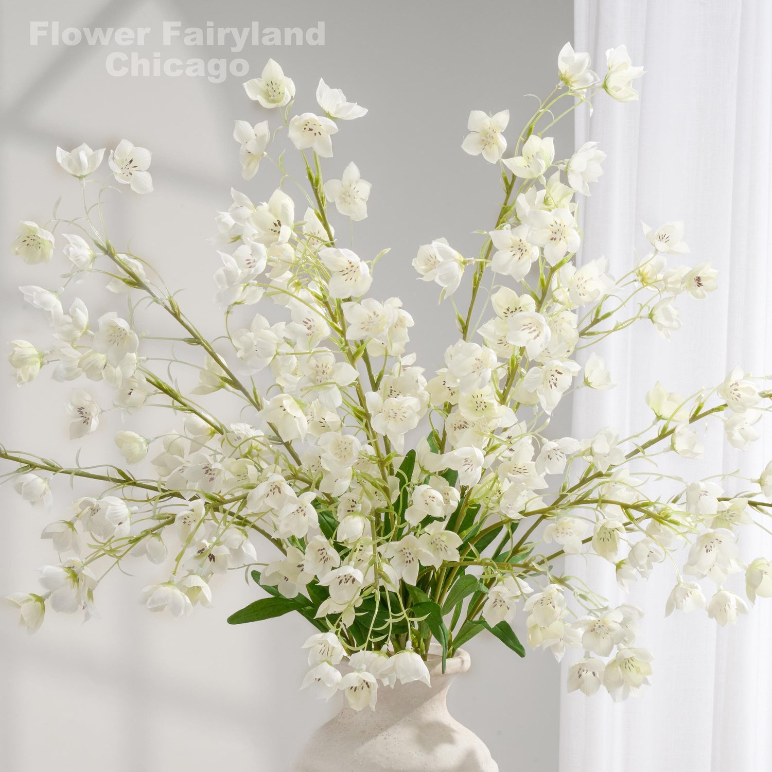 37 inch faux Enkianthus quinqueflorus stems in white styled in a vase