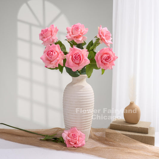 Lipstick pink roses styled in a vase