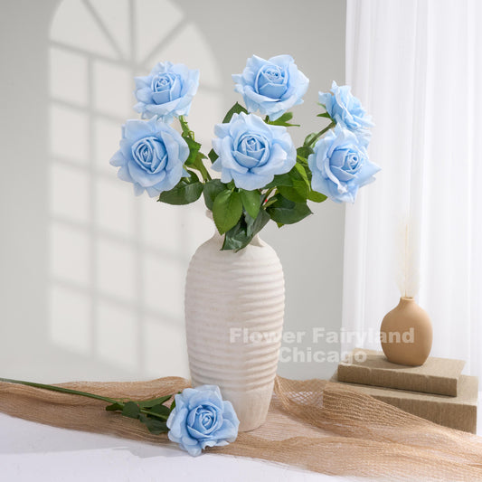 Light sky blue roses styled in a vase