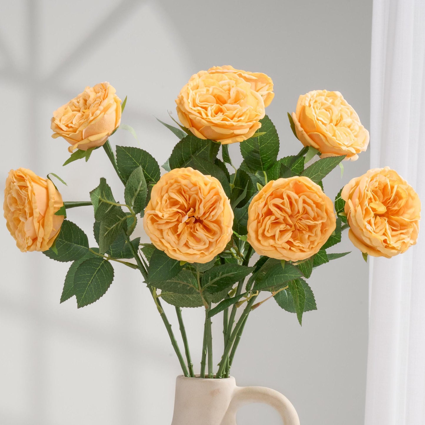 Yellowish orange real touch David Austin rose stems in vase