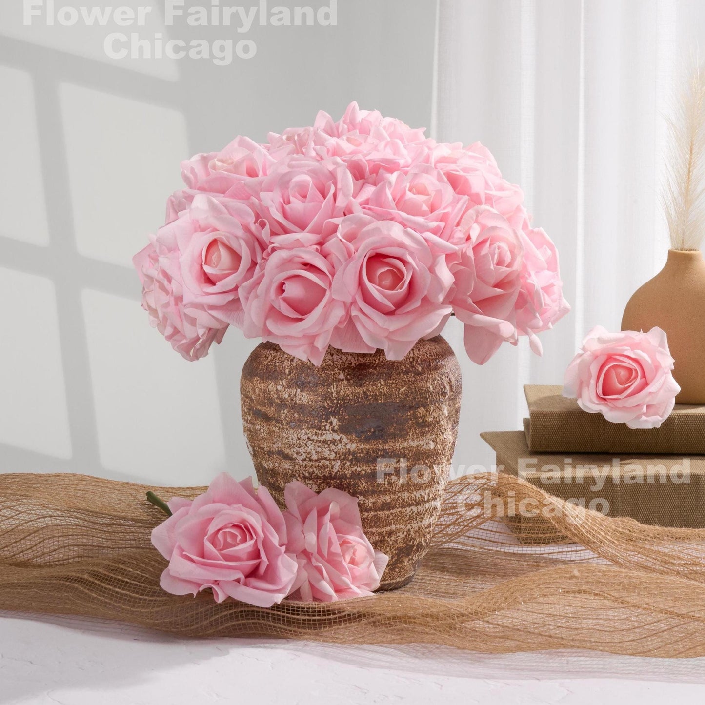 Light pink rose bouquet with loose stems styled in vase