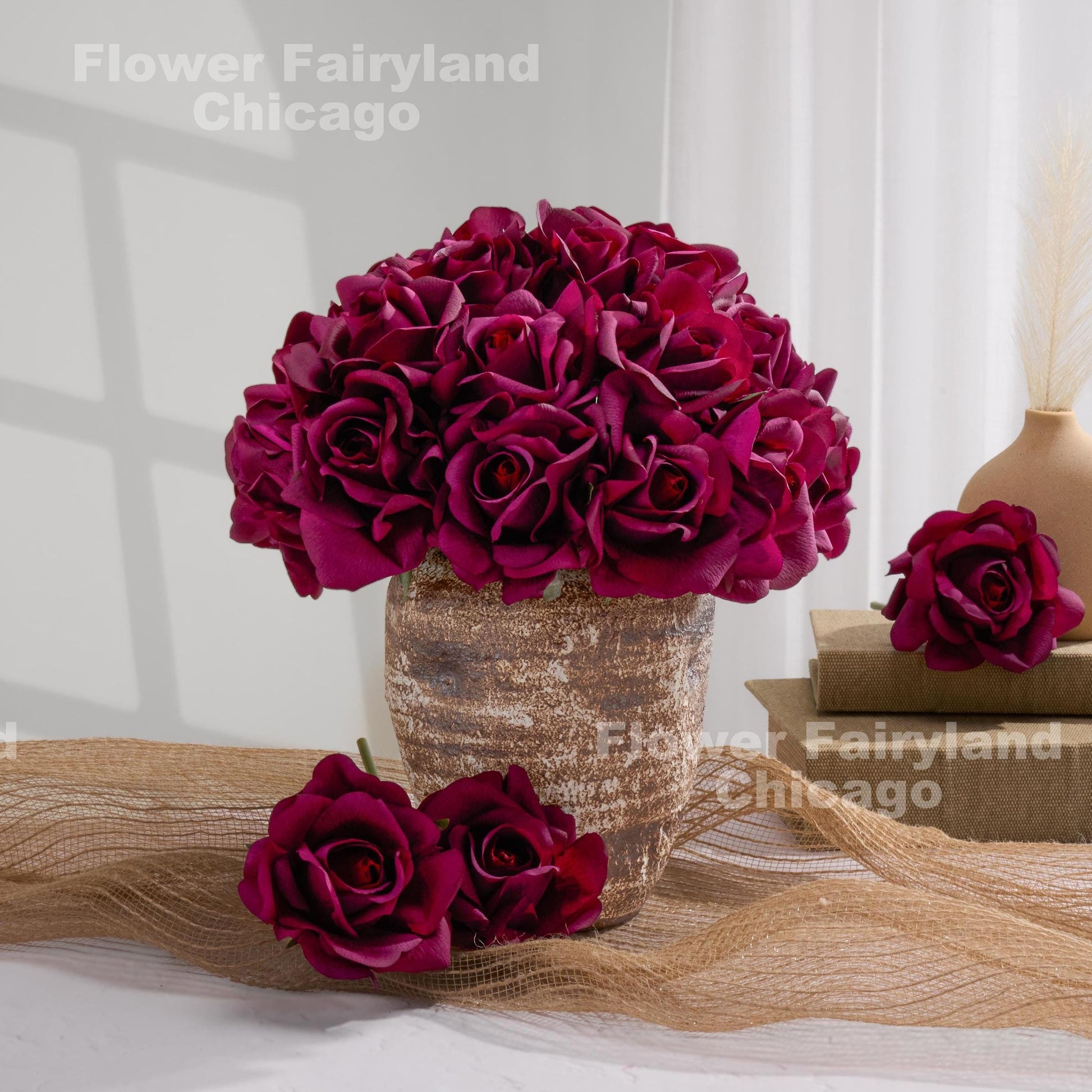 Dark purple roses styled in vase