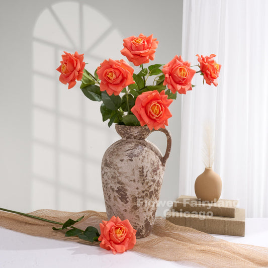Orange ombre roses styled in a home decor scene