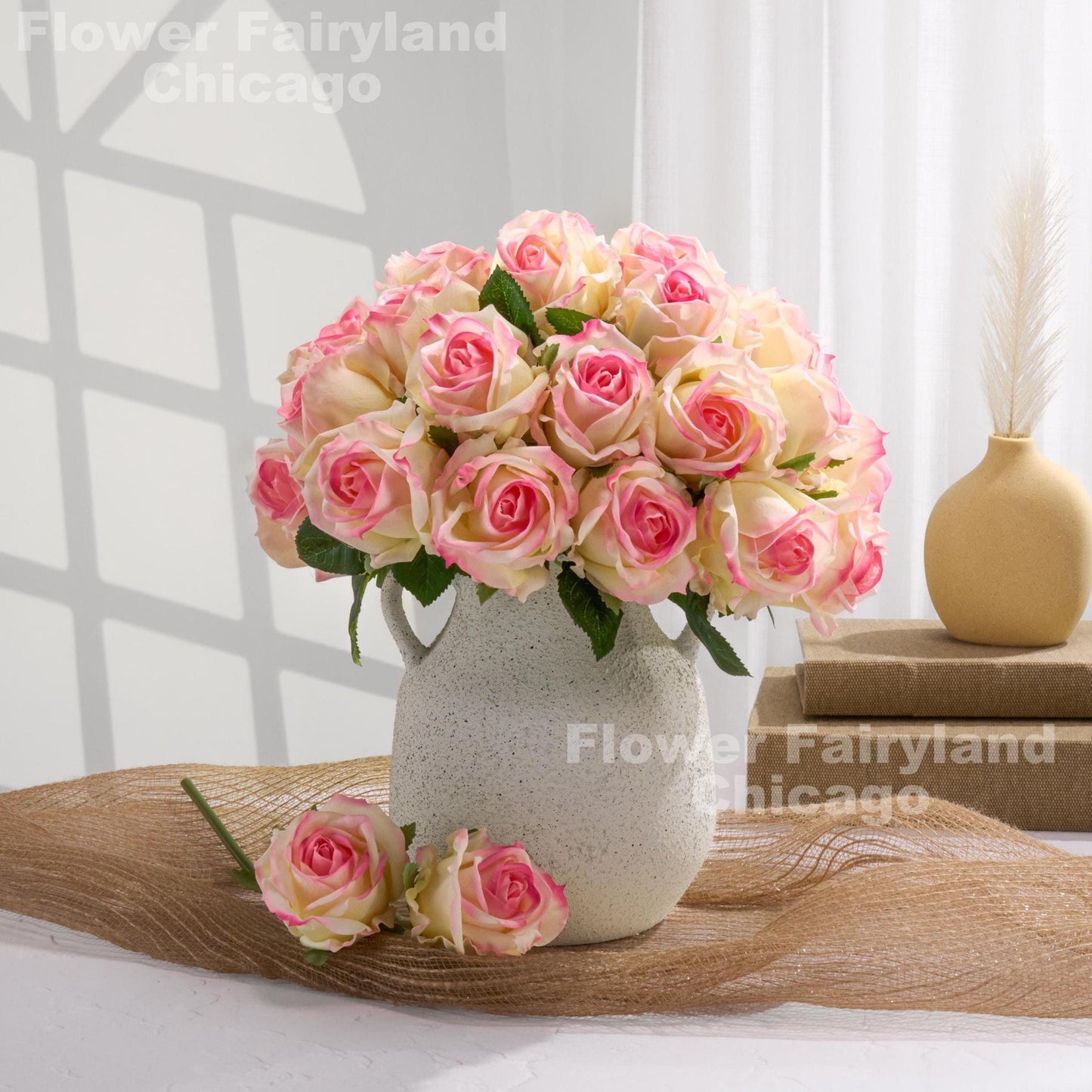 Yellow and pink roses styled in vase