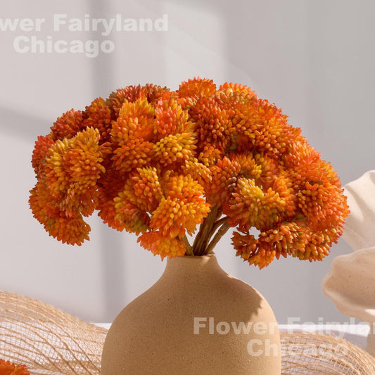 Orange sedum cluster arrangement in a vase