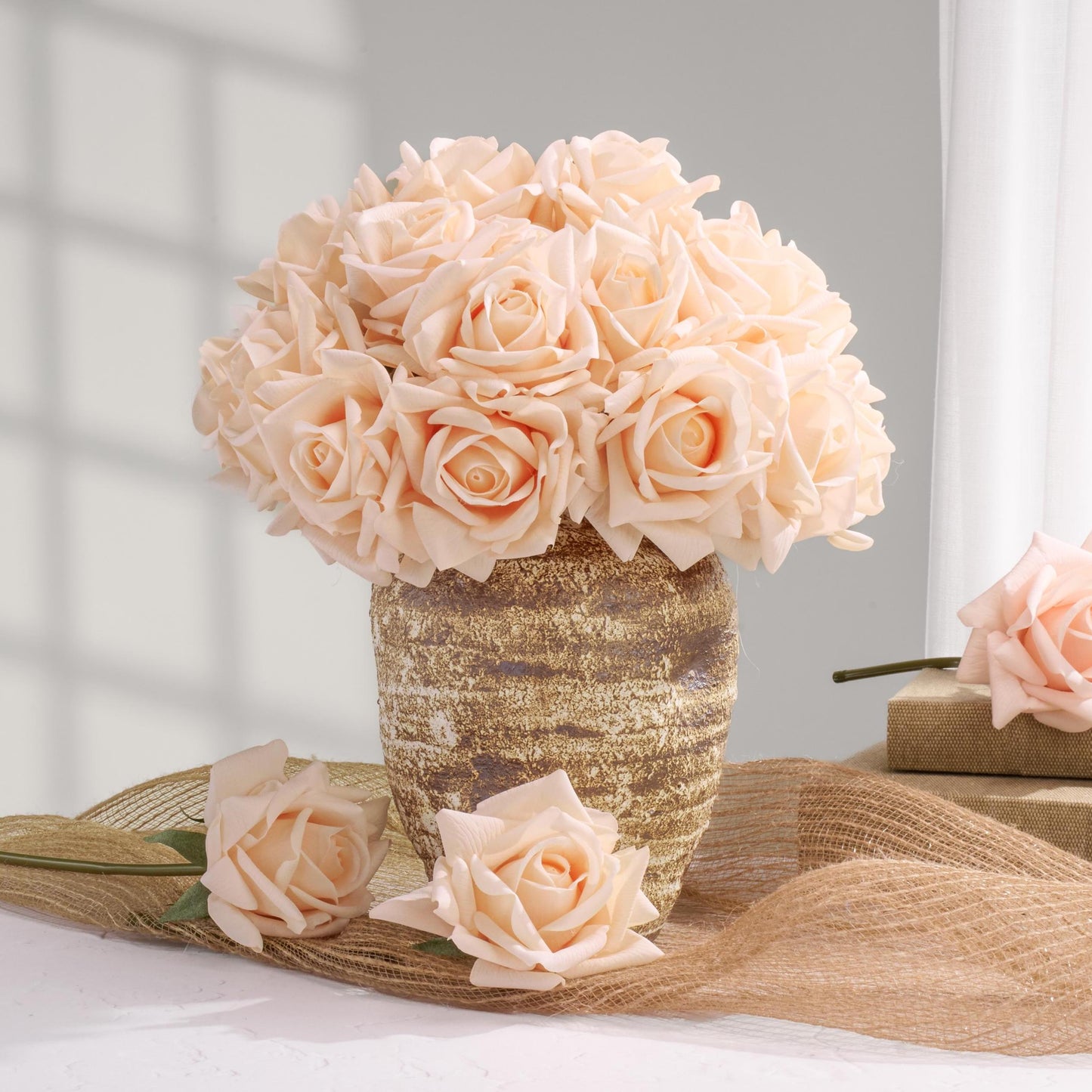 Peach rose bouquet styled in home decor setting