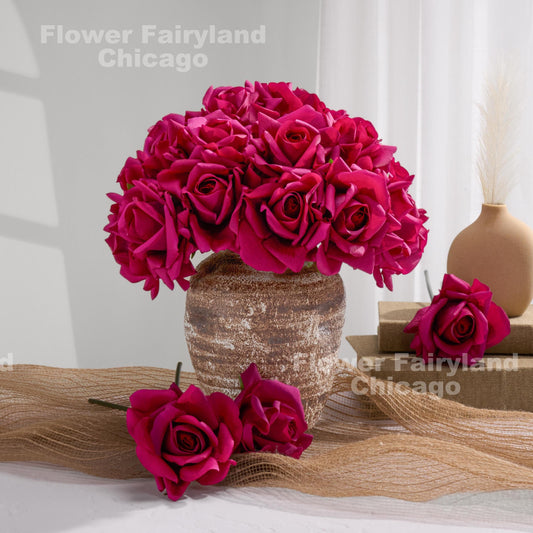Deep magenta roses styled in vase