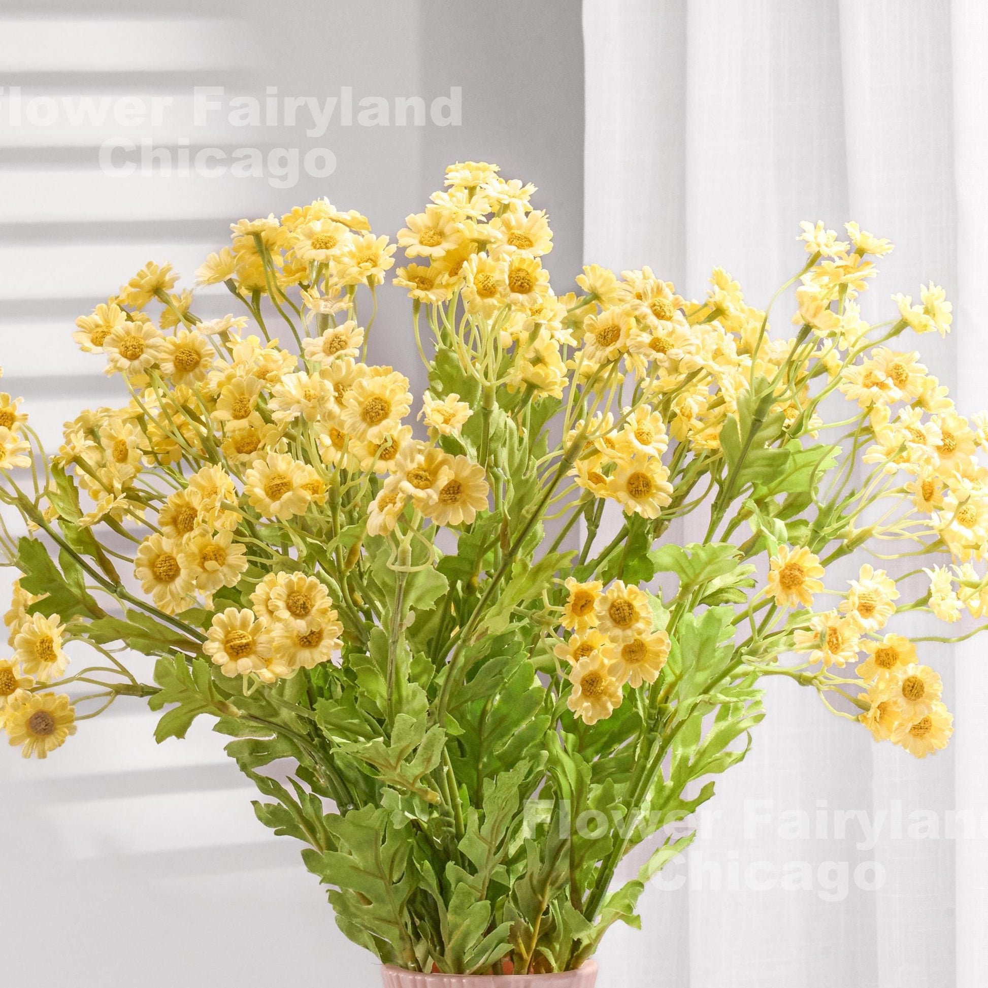 Yellow faux chamomile styled in a vase