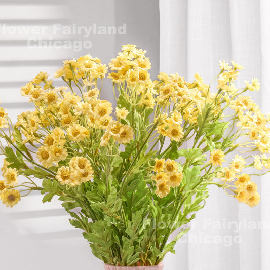 Yellow faux chamomile styled in a vase
