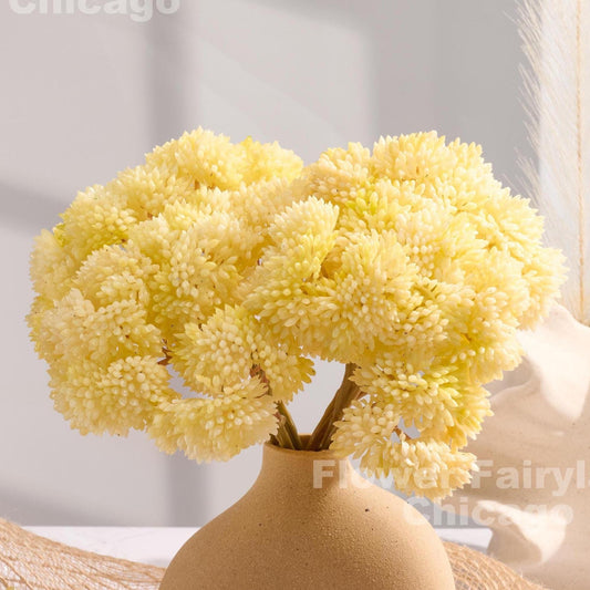 Yellowish cream sedum cluster arrangement in a vase