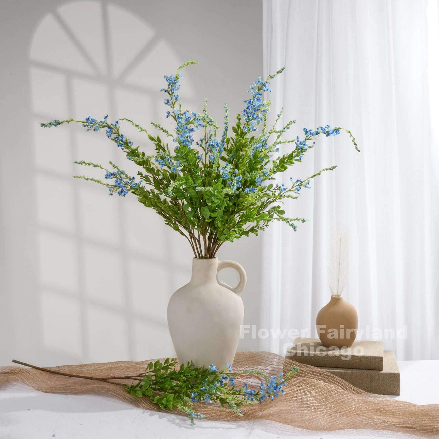Blue sage branches styled in vase