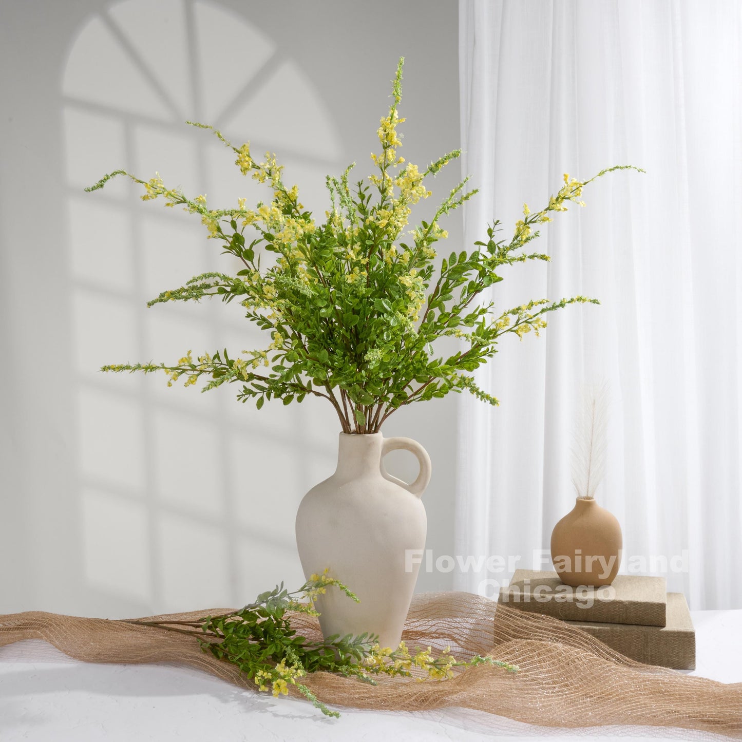 Yellow sage branches styled in vase