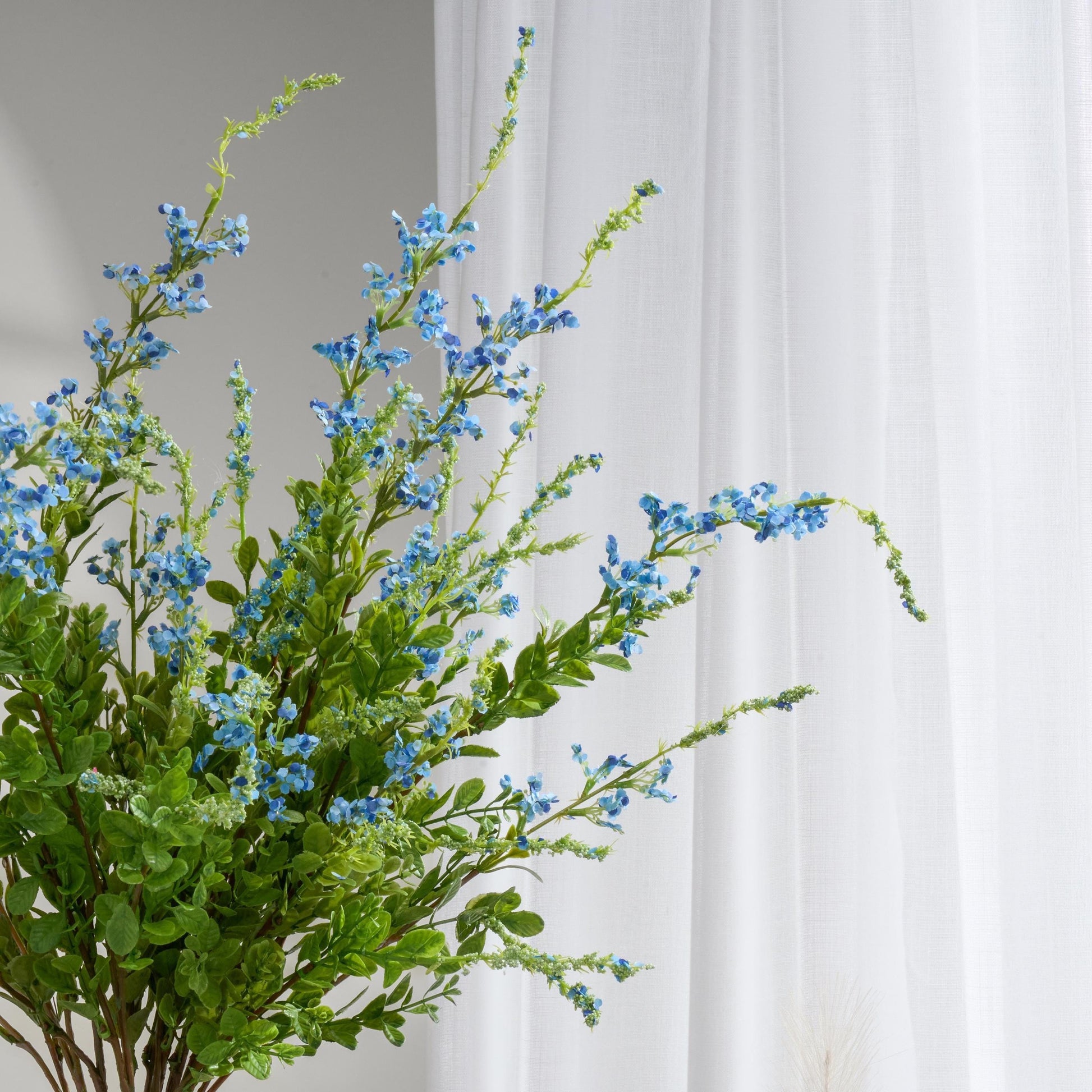 Blue faux sage plant branch