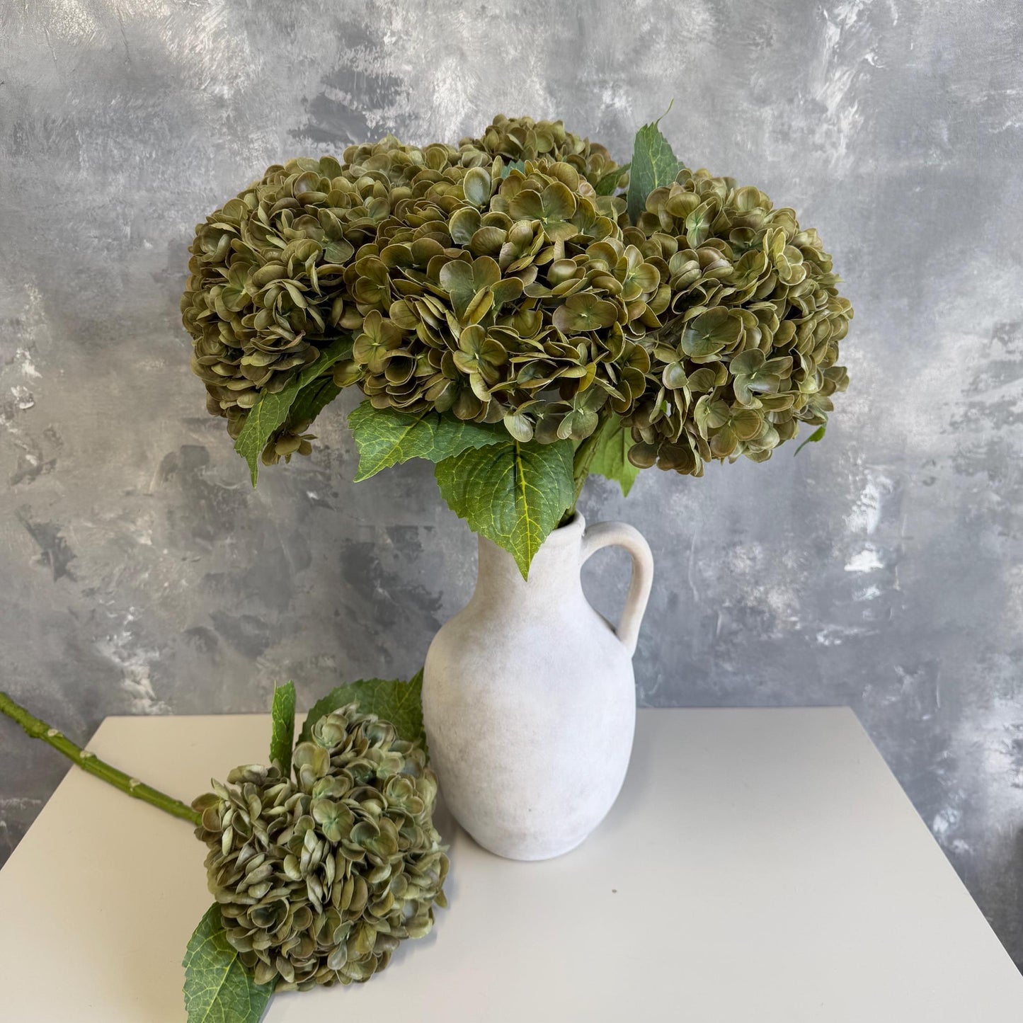 Brownish green hydrangea in arrangement