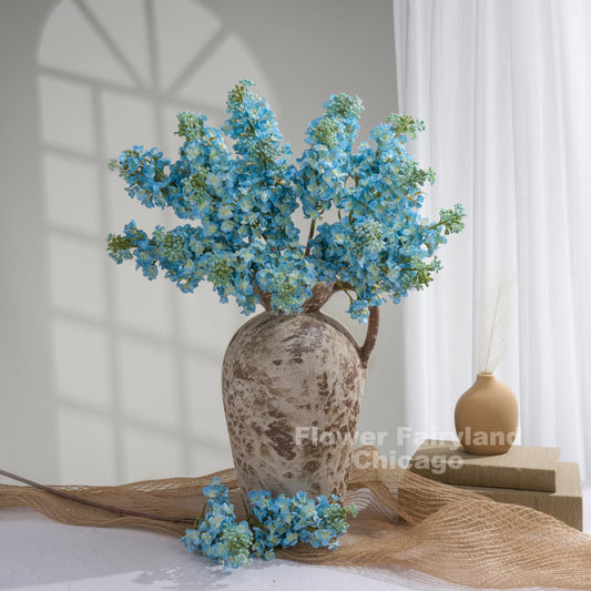 Aqua blue lilac arrangement in vase