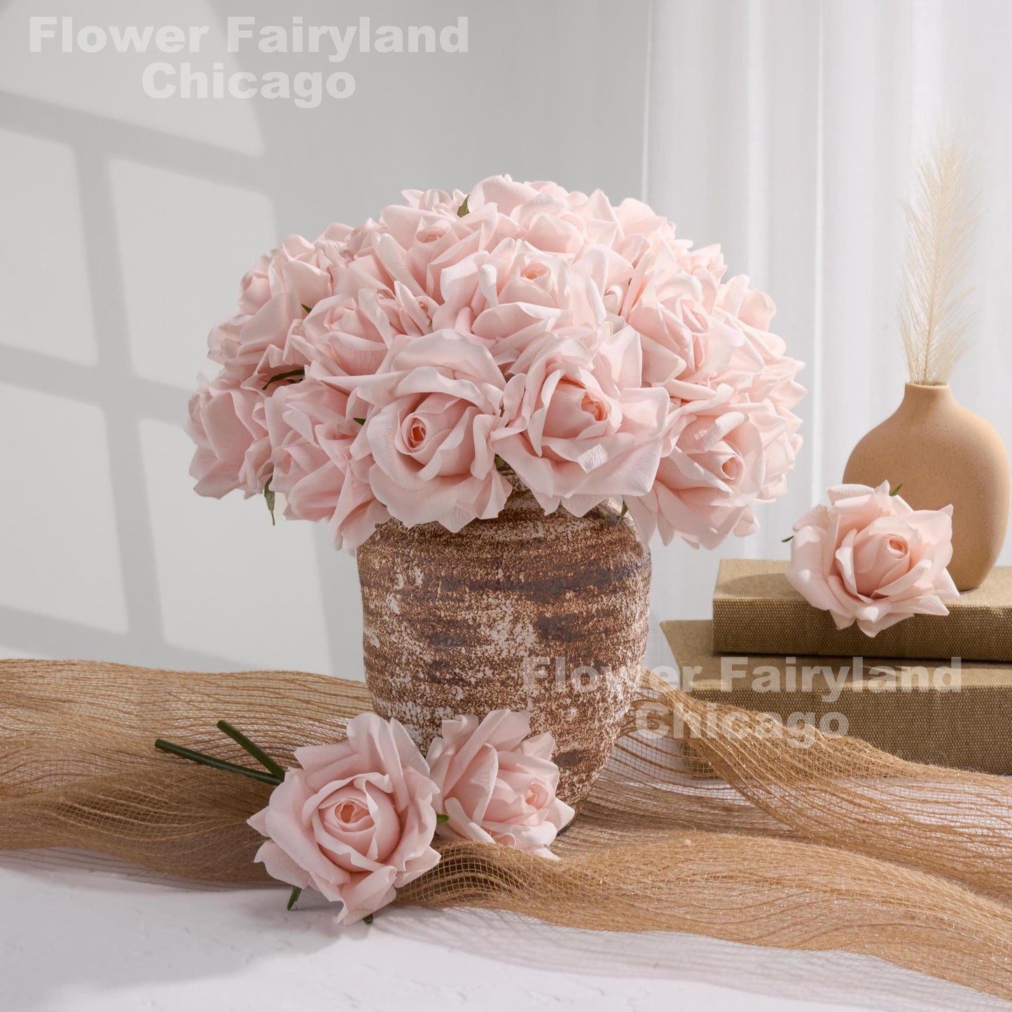 Pale pink roses styled in vase