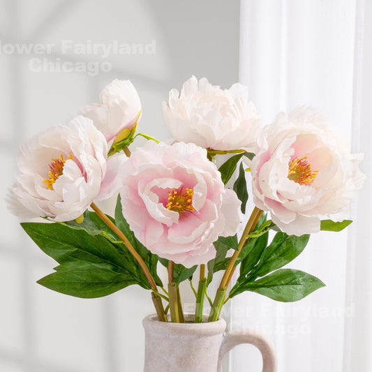 Mauve ivory faux peonies styled in a vase