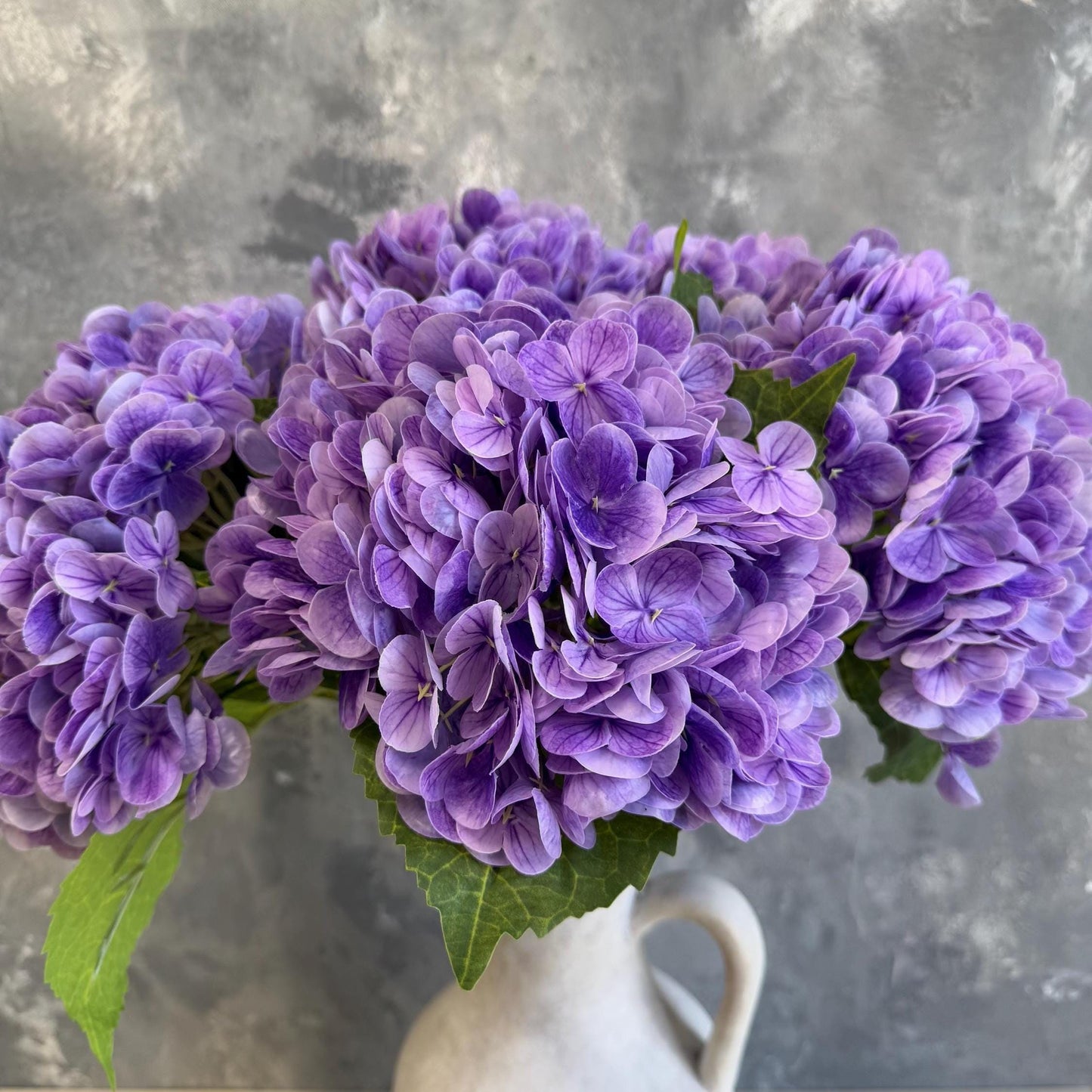 Electric purple hydrangea in arrangement