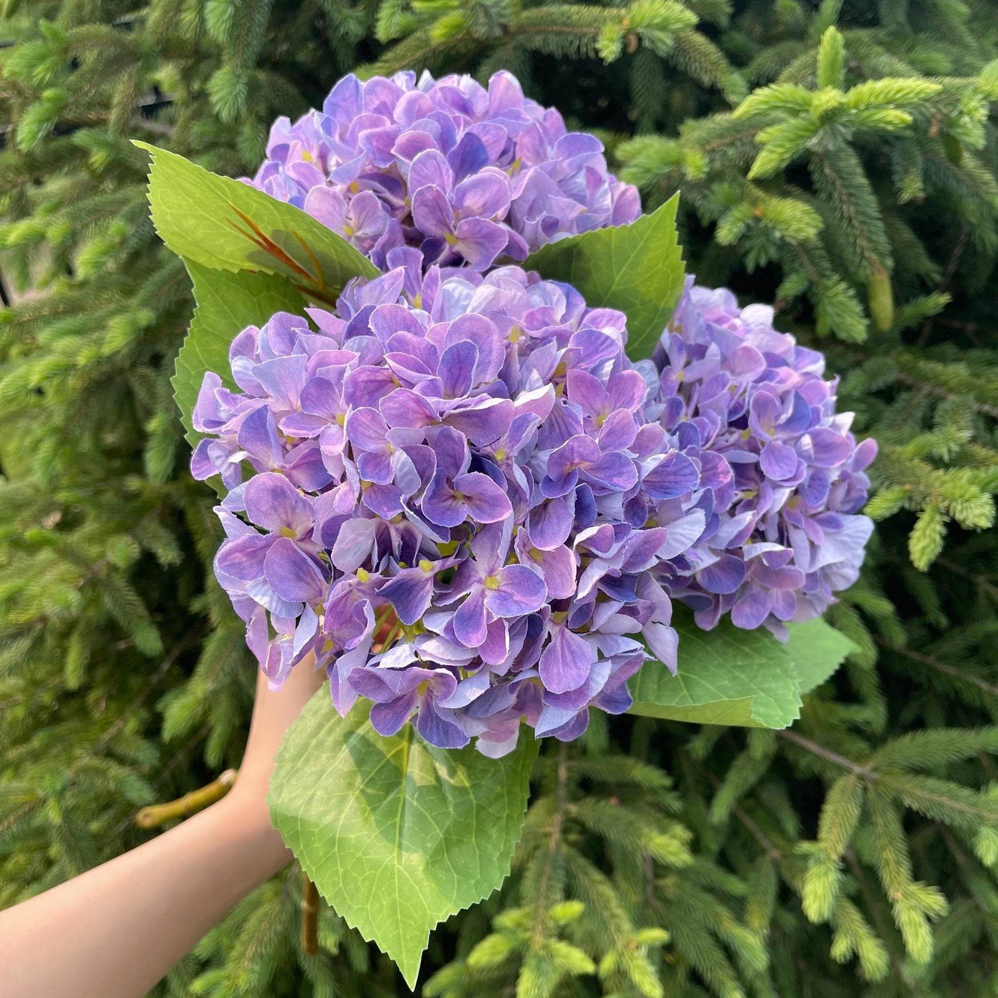 Purple faux hydrangea bloom close-up