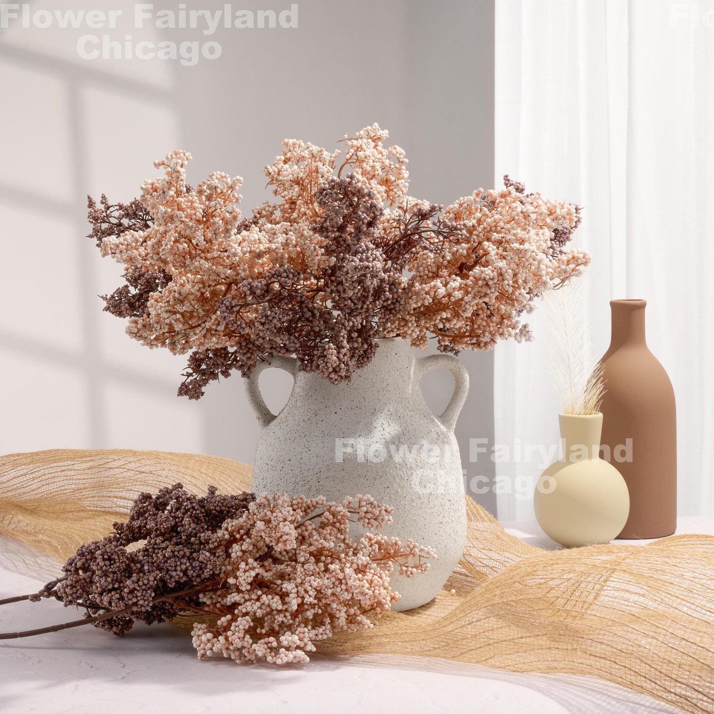 Pale pink mini berries in arrangement