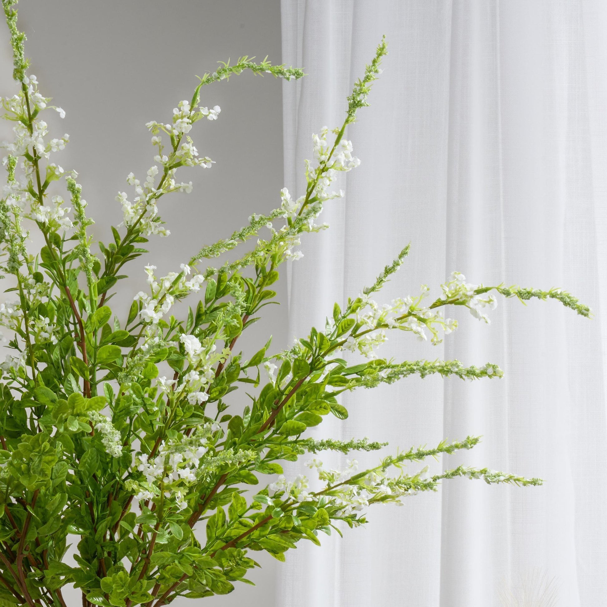 Bright white faux sage plant branch
