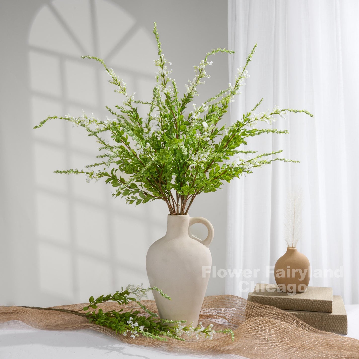 White sage branches styled in vase