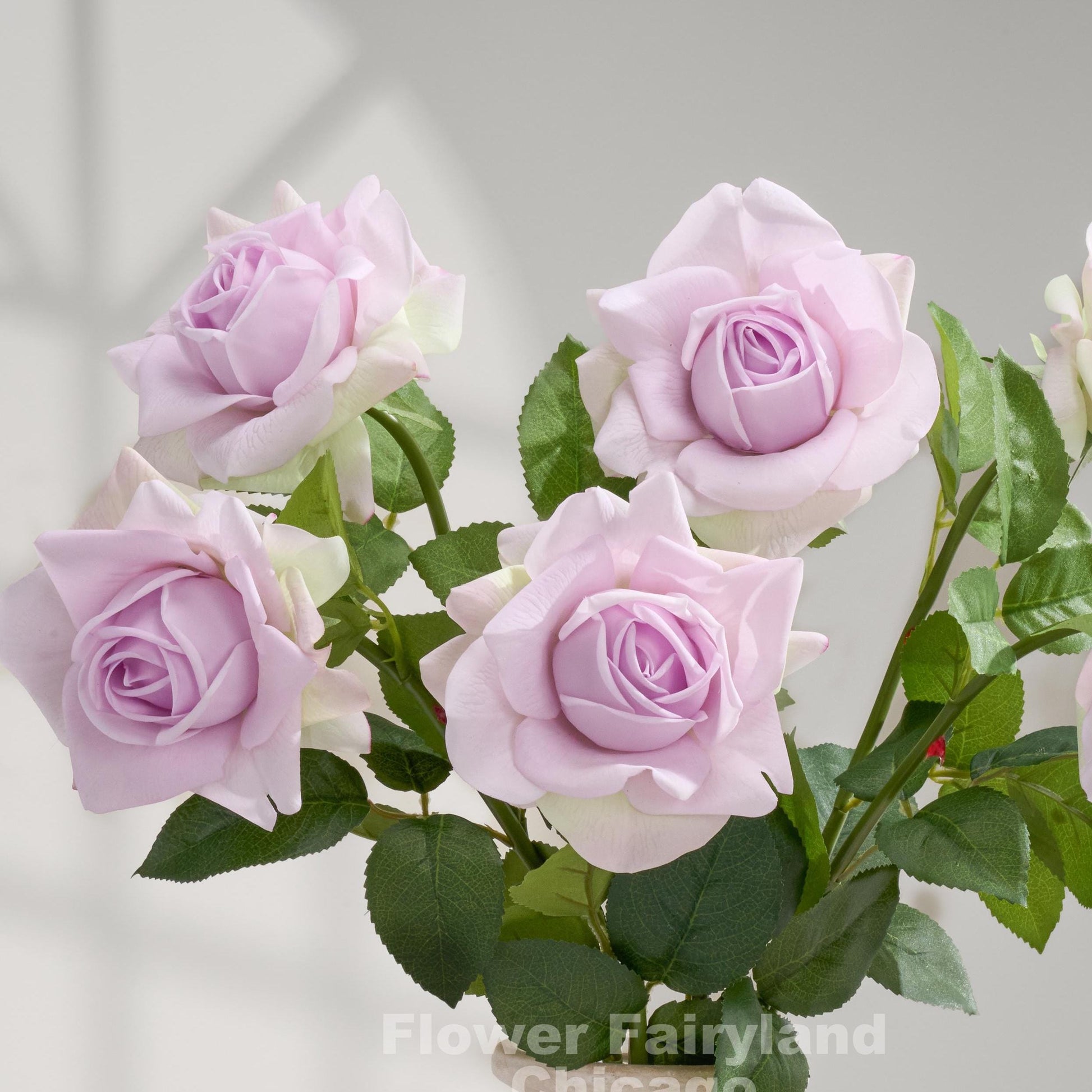 Soft purple real touch full bloom roses close up