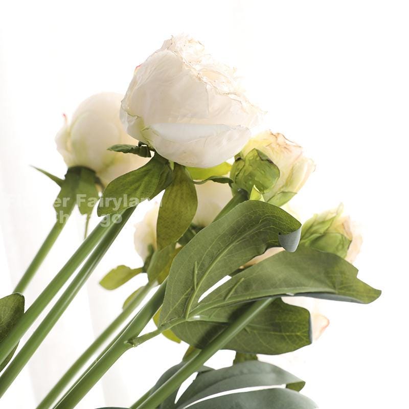 Milky white dried look bouquet styled in home decor