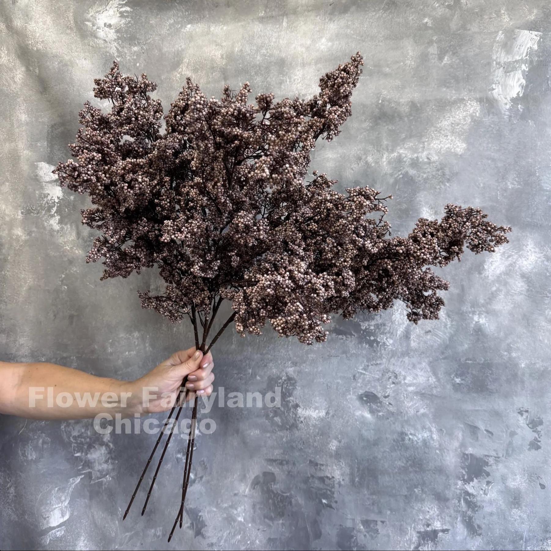Purplish brown mini berries in arrangement