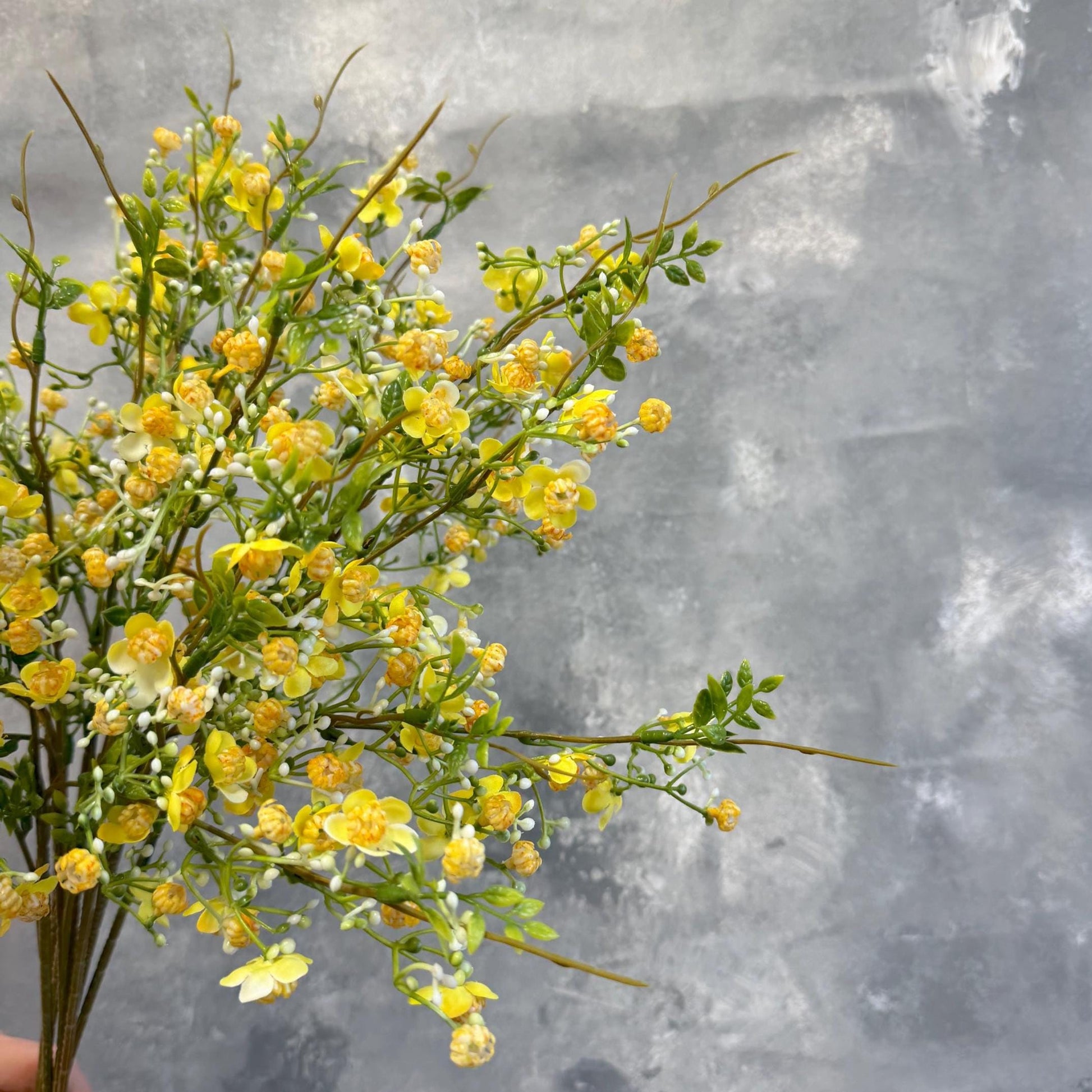 Yellow faux wax flower branch detail
