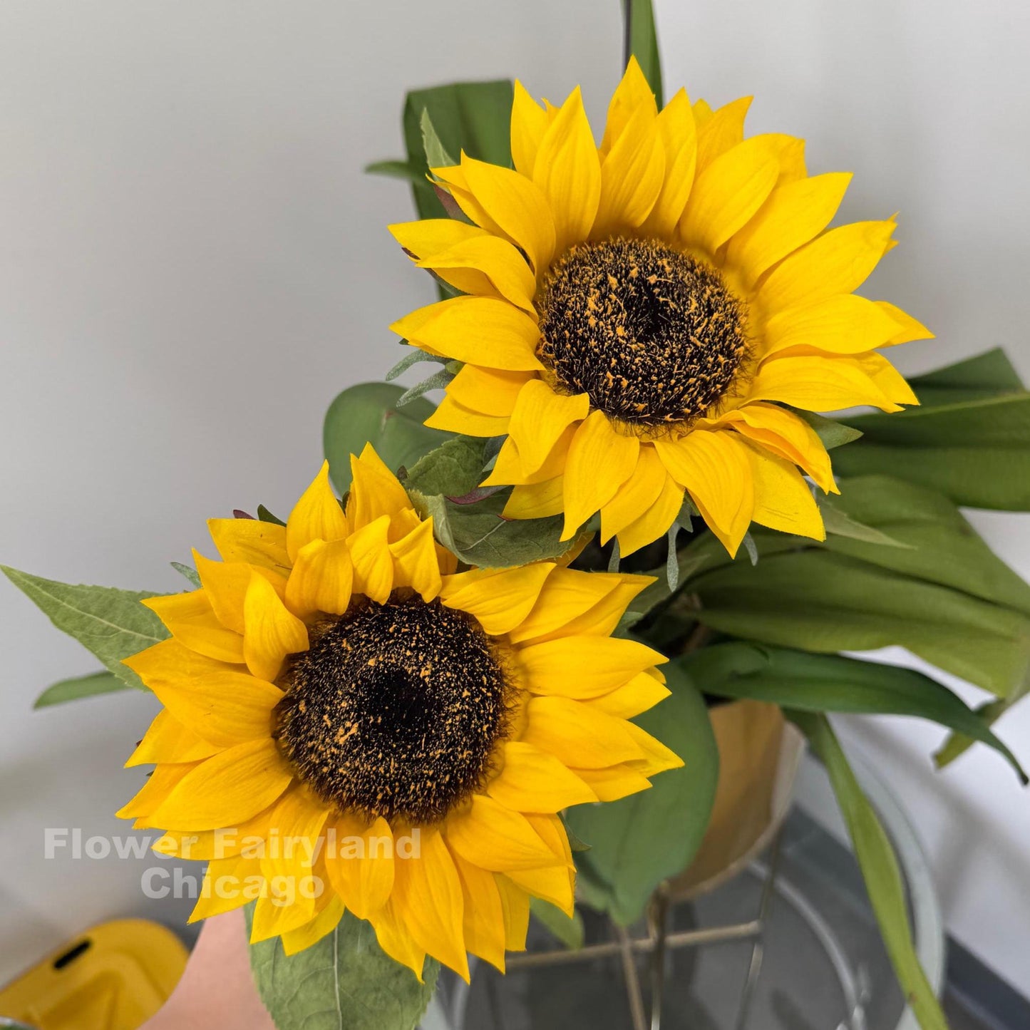 Yellow real touch sunflower stem with leaves